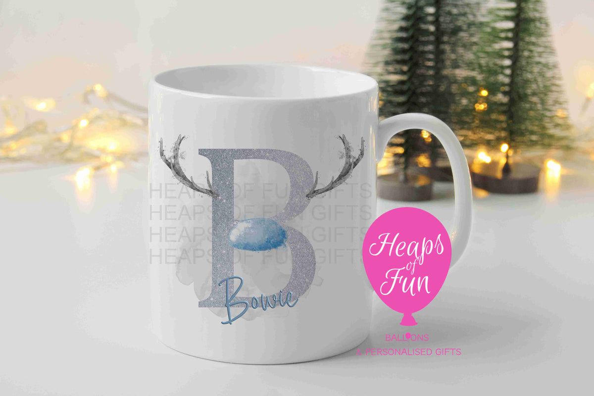 Personalised Christmas mug with silver reindeer initial, antlers, blue nose and name