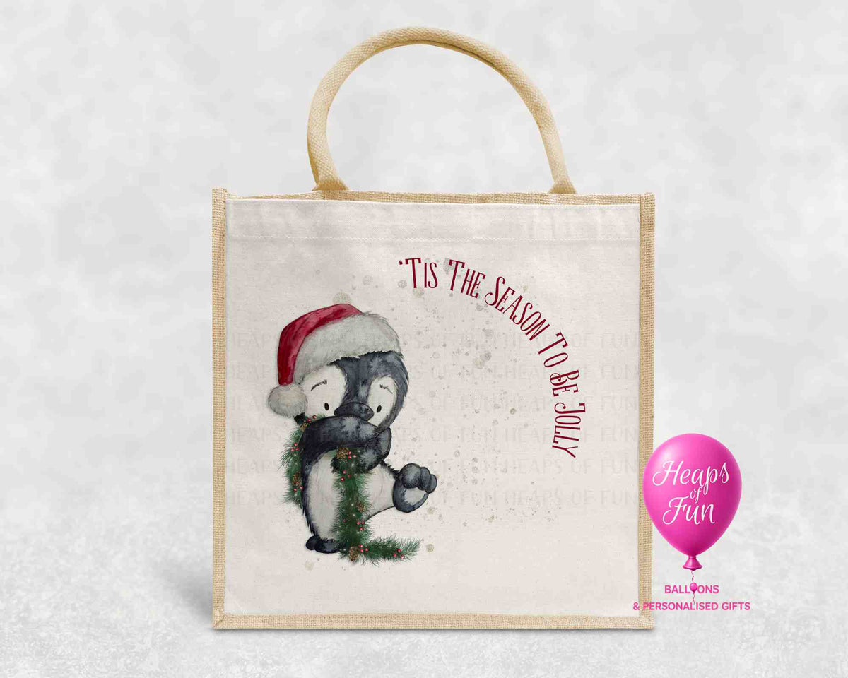 Tis the Season to be Jolly Christmas jute bag with watercolour penguin in Santa hat and festive garland