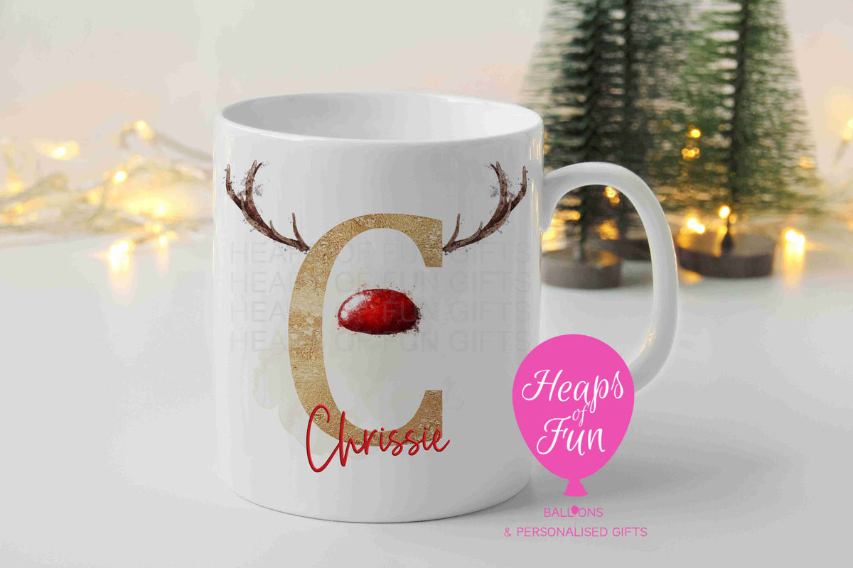 Personalised Christmas mug with gold reindeer initial, antlers, red nose and name