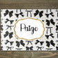 Personalised glass makeup board with black and gold bows and custom name