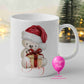 Personalised cream teddy bear Christmas mug with Santa hat, present and name
