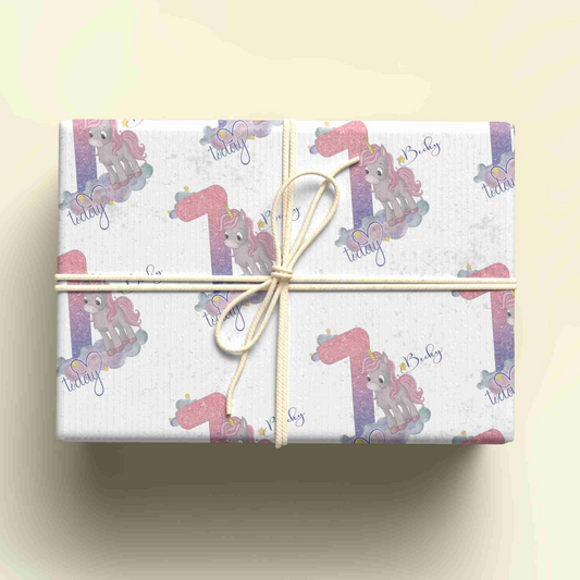 a wrapped gift box with a pink horse design