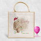 Personalised Christmas jute bag with bear in Santa hat tangled in colourful fairy lights and name