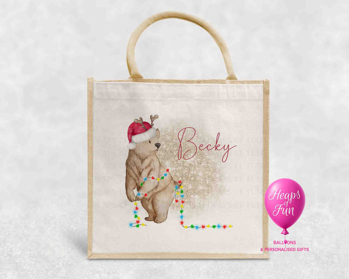 Personalised Christmas jute bag with bear in Santa hat tangled in colourful fairy lights and name