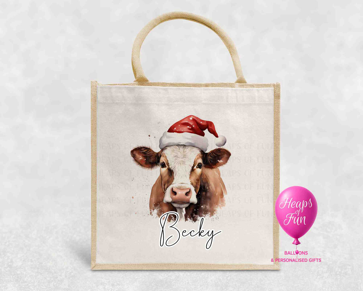 Personalised Christmas jute bag with watercolour brown and white cow in Santa hat and name