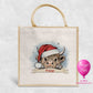 Personalised Highland cow Christmas jute bag with Santa hat and name banner