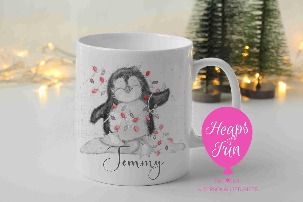 Personalised penguin Christmas mug with red fairy lights and name